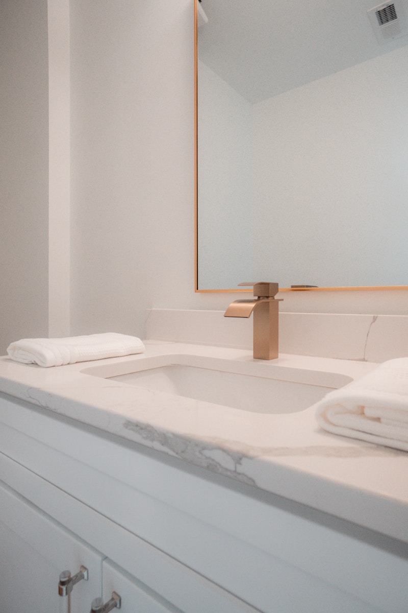 A bathroom sink with a large mirror above it